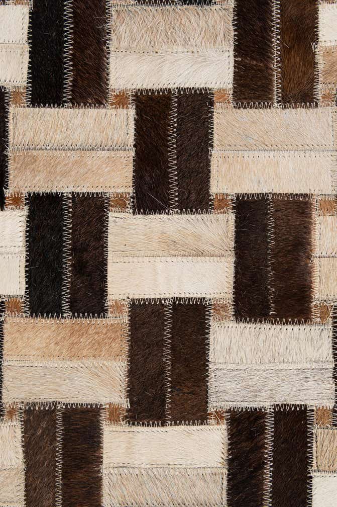 4' 11 x 7' 10 Cowhide - Patchwork Rug