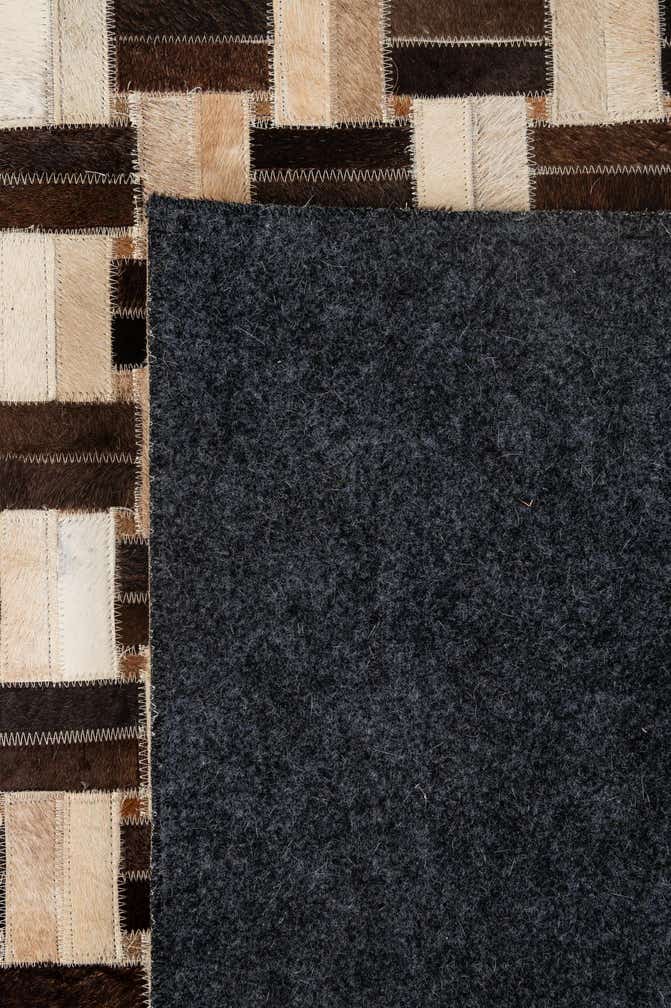 4' 11 x 7' 10 Cowhide - Patchwork Rug