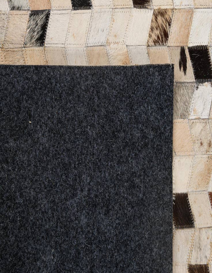 Detail image of 5' 1 x 7' 10 Cowhide - Patchwork Rug