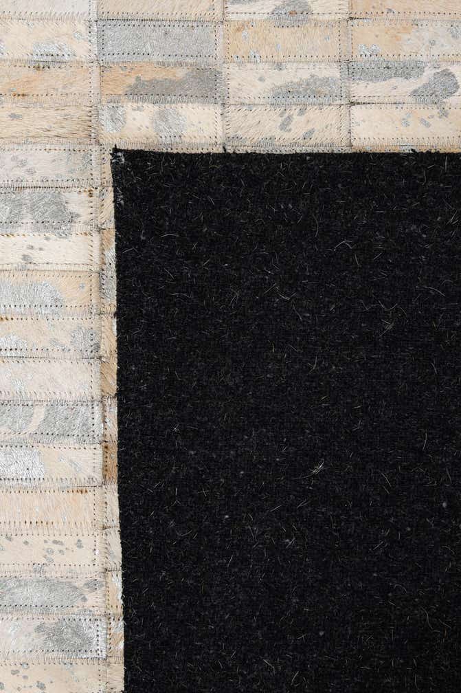 4' 11 x 7' 11 Cowhide - Patchwork Rug