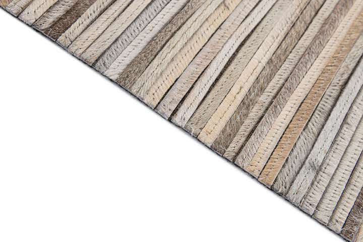 4' 11 x 8' 1 Cowhide - Patchwork Rug