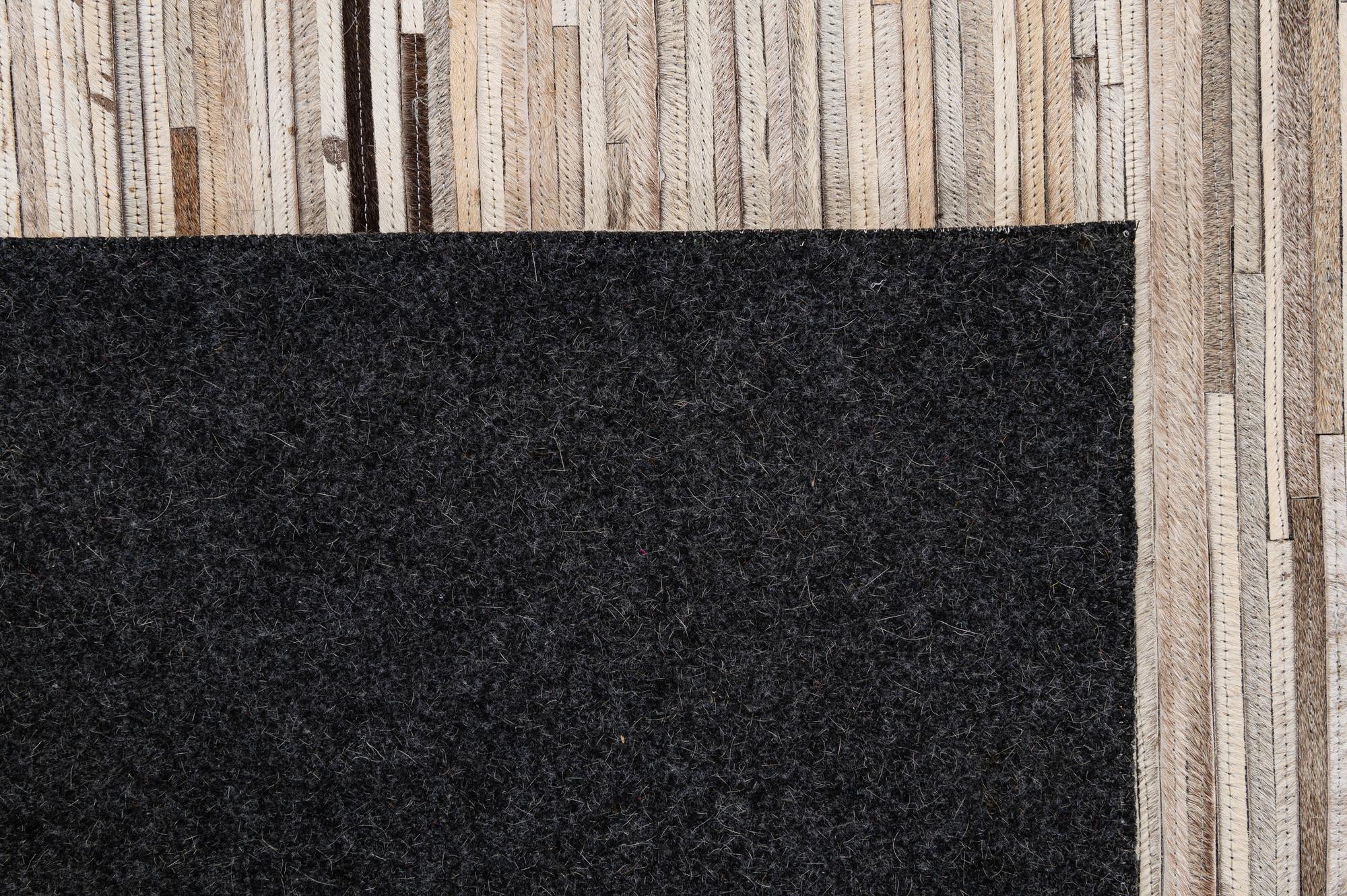 4' 11 x 8' 1 Cowhide - Patchwork Rug