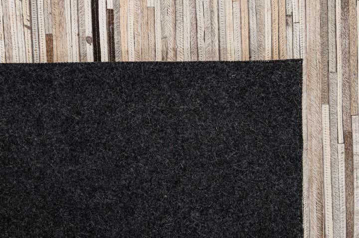 4' 11 x 8' 1 Cowhide - Patchwork Rug