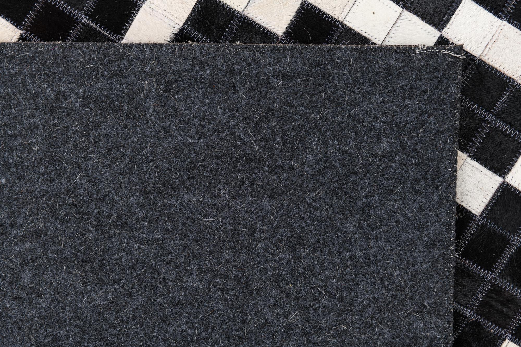 5' 2 x 8' 2 Cowhide Leather Rug