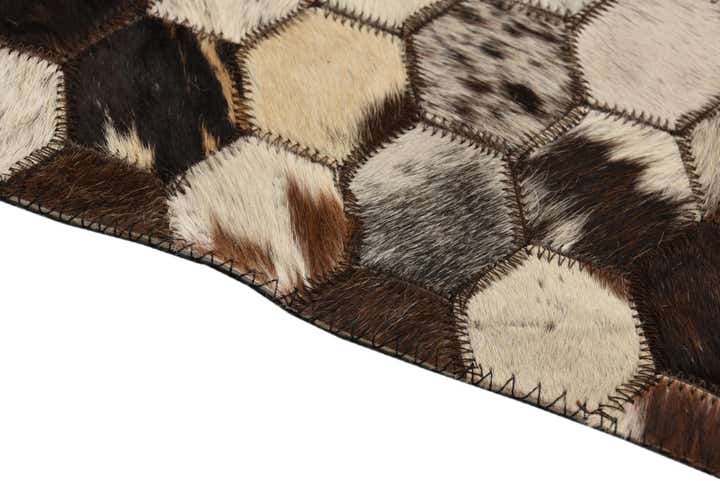 5' 2 x 8' 1 Cowhide Rug