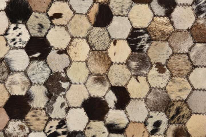 5' 2 x 8' 1 Cowhide Rug