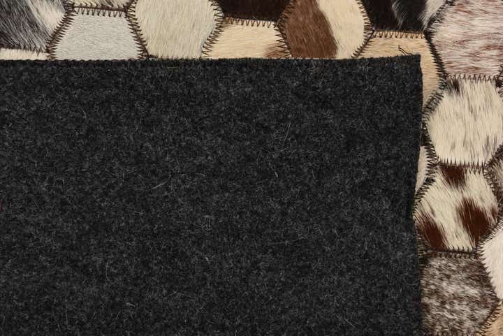 5' 2 x 8' 1 Cowhide Rug