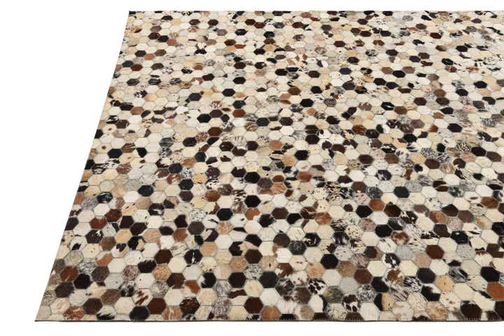5' 2 x 8' 1 Cowhide Rug