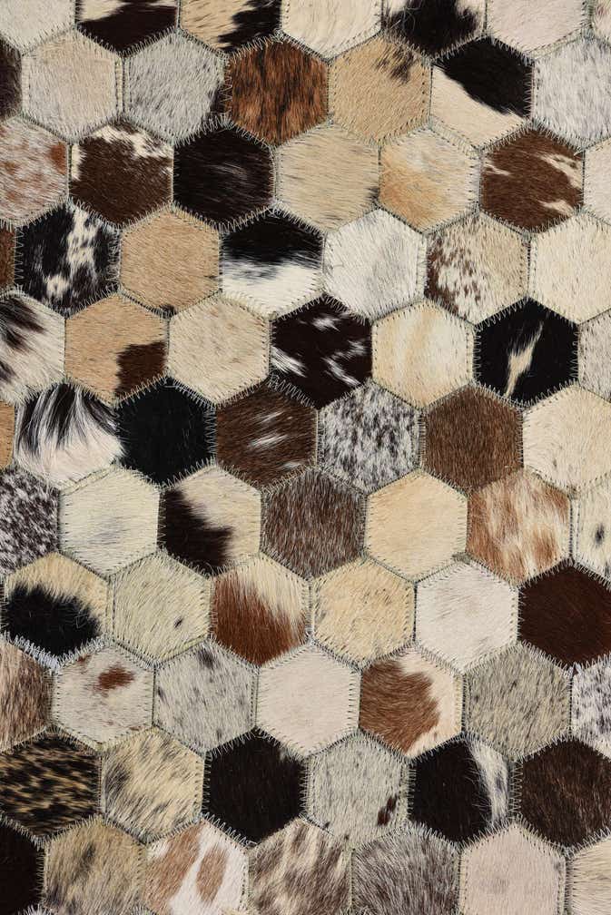 5' 2 x 8' 1 Cowhide Rug