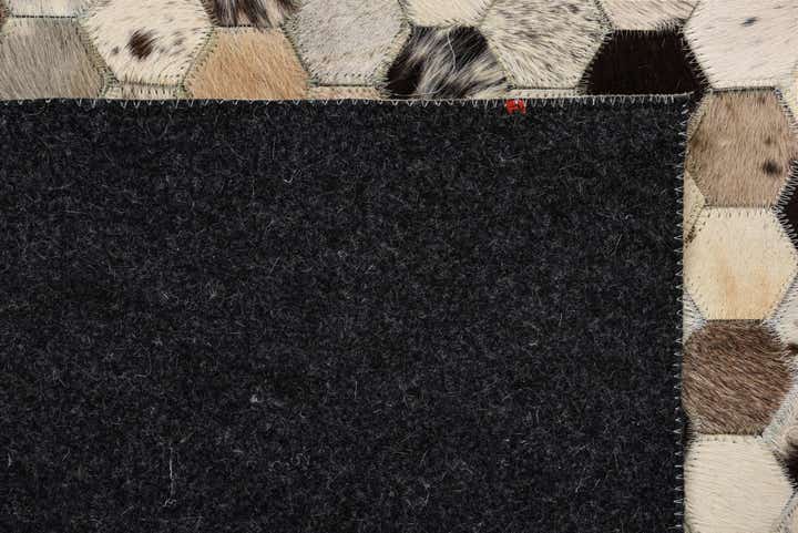 5' 2 x 8' 1 Cowhide Rug