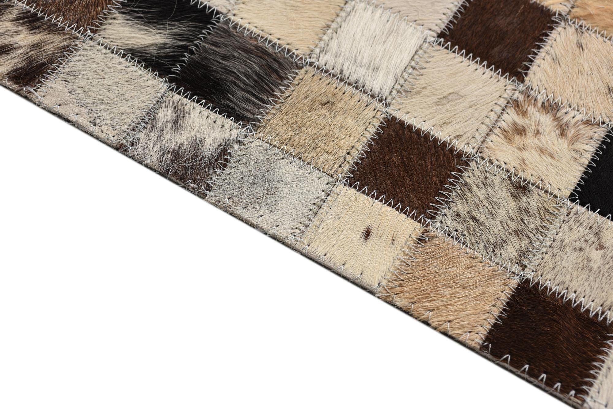 5' 2 x 8' 1 Cowhide Rug