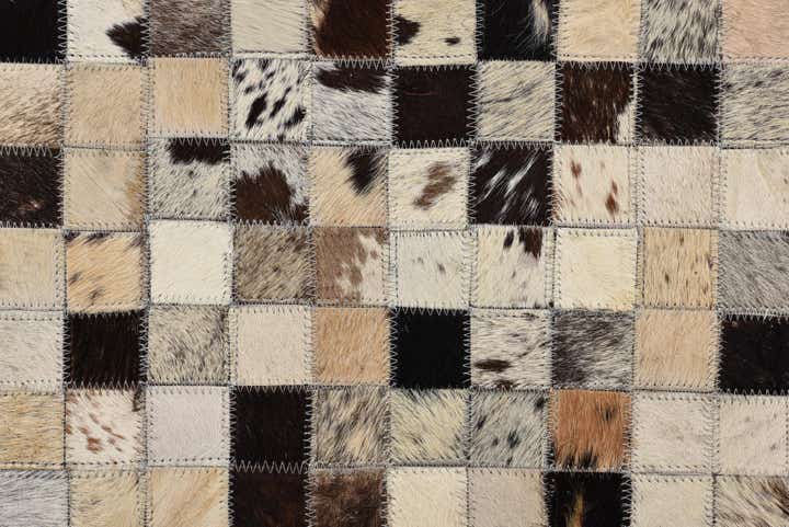 5' 2 x 8' 1 Cowhide Rug