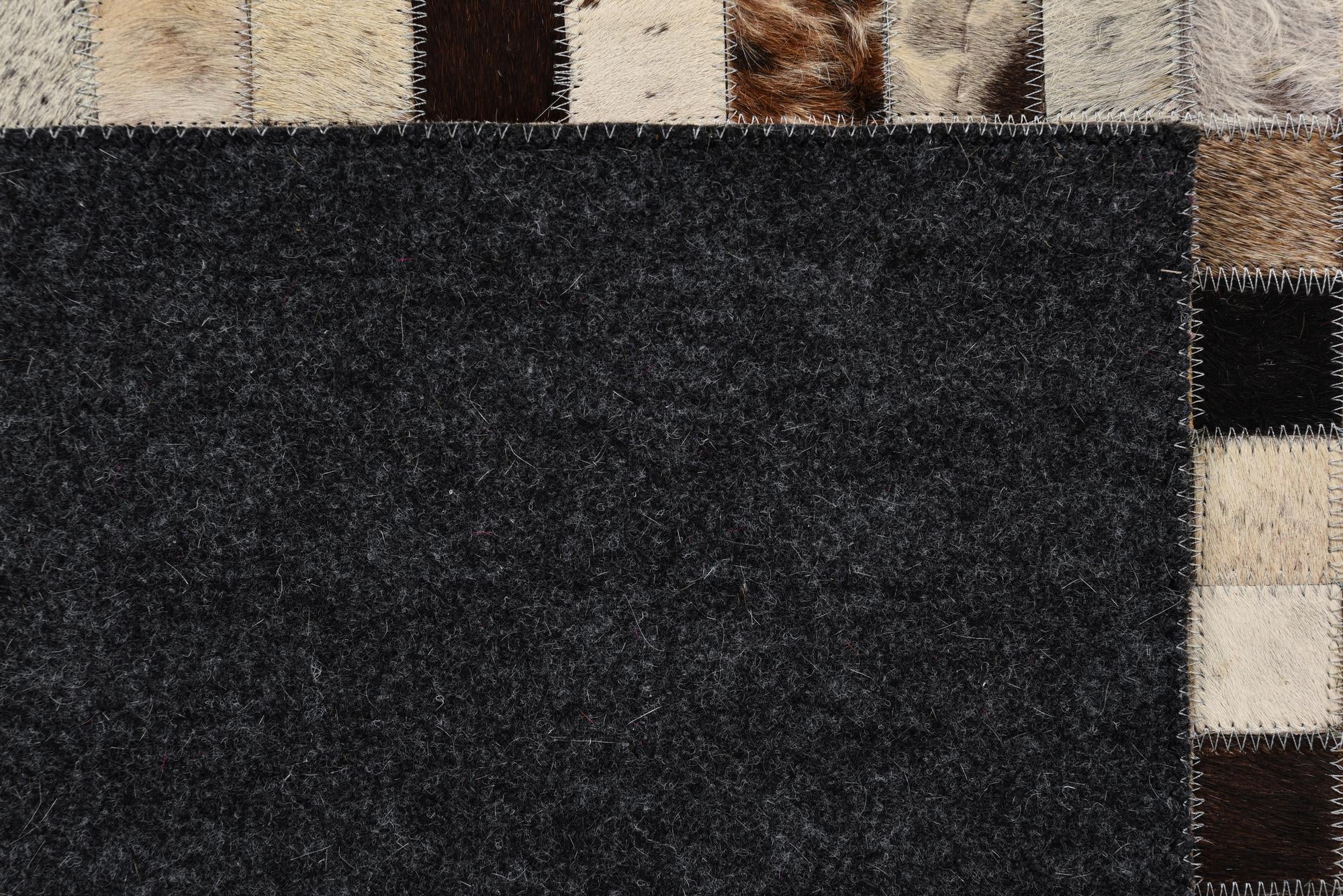 5' 2 x 8' 1 Cowhide Rug