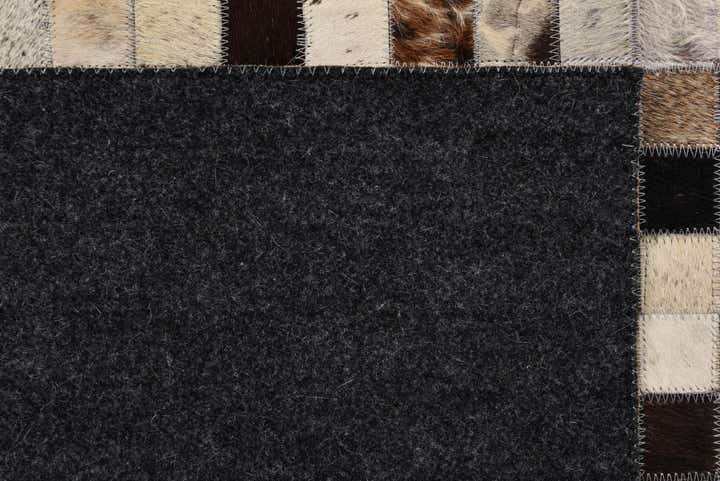 5' 2 x 8' 1 Cowhide Rug