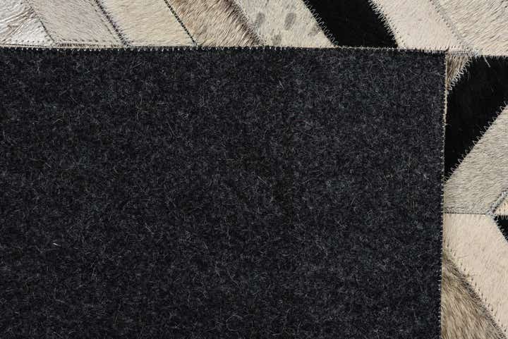 5' 2 x 8' 3 Cowhide Rug