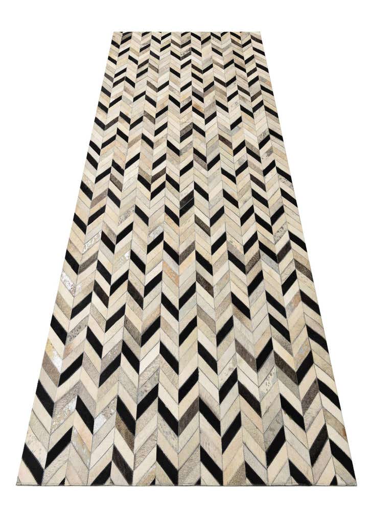 5' 2 x 8' 1 Cowhide Rug