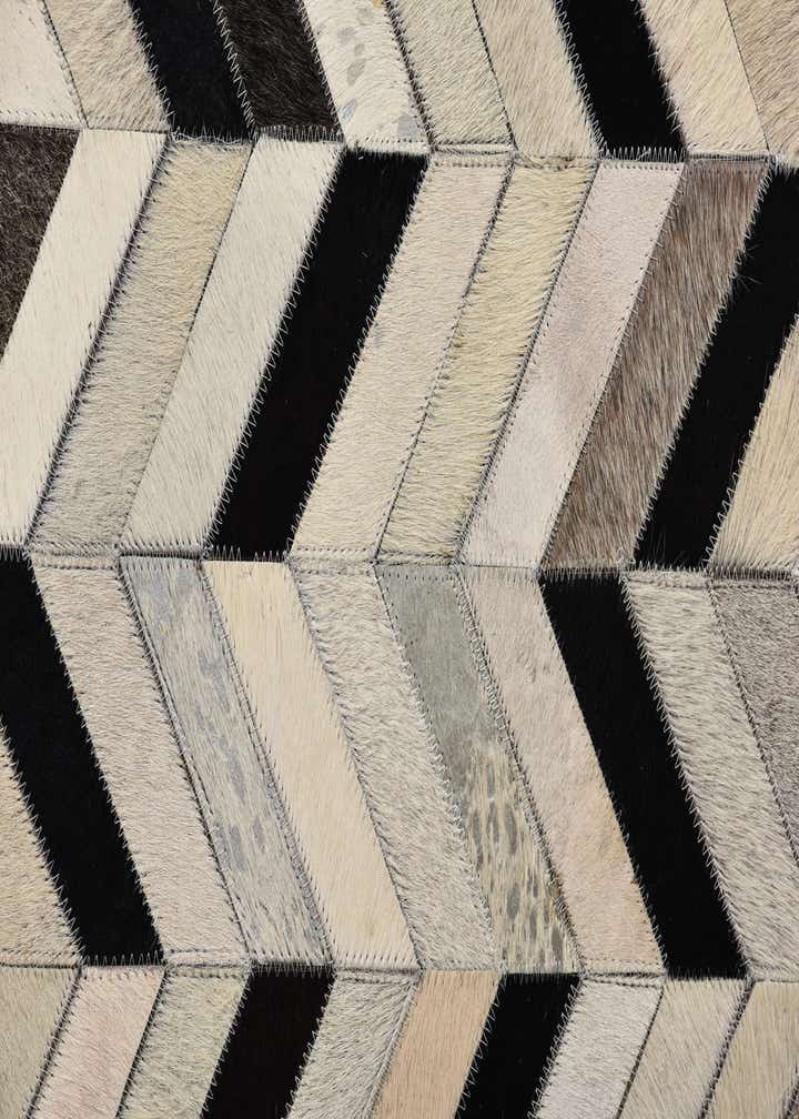 5' 2 x 8' 1 Cowhide Rug