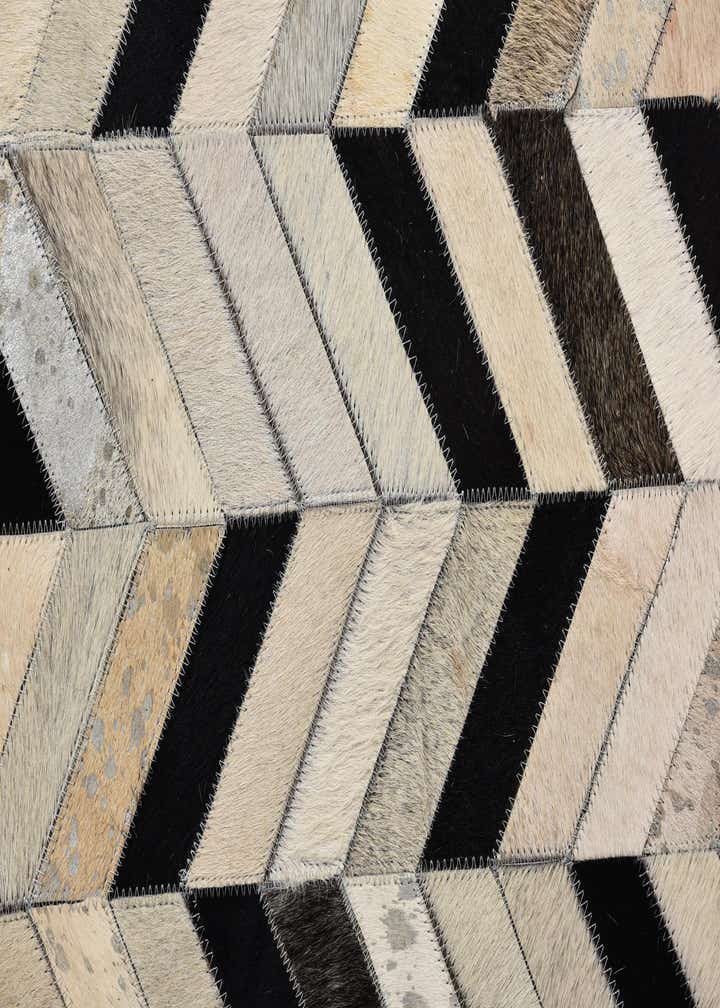 5' 2 x 8' 1 Cowhide Rug