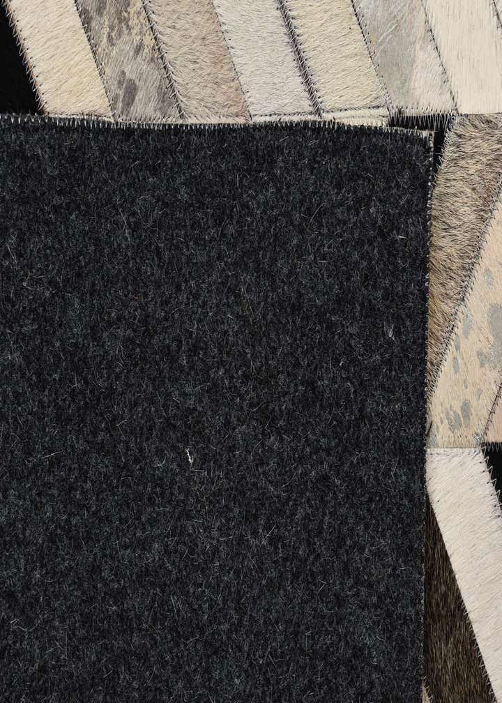 5' 2 x 8' 1 Cowhide Rug