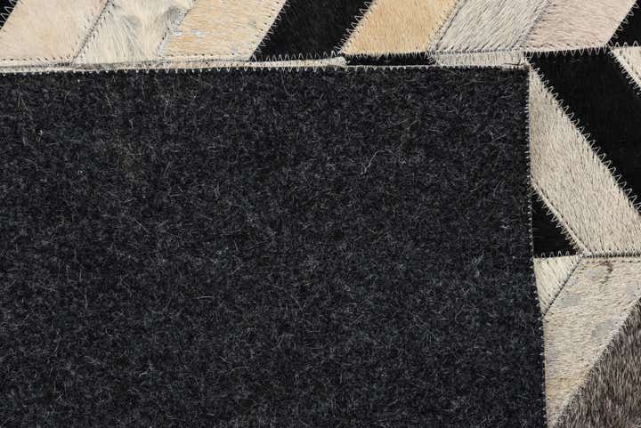 5' 3 x 8' 1 Cowhide Rug