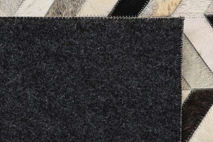 5' 3 x 8' 1 Cowhide Rug