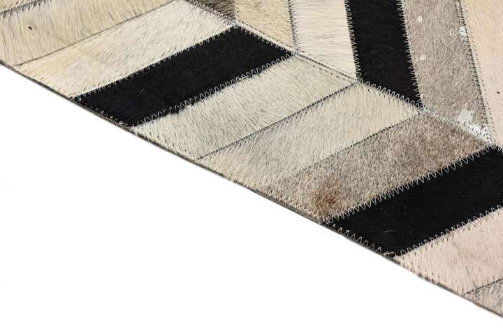 5' 3 x 8' 1 Cowhide Rug