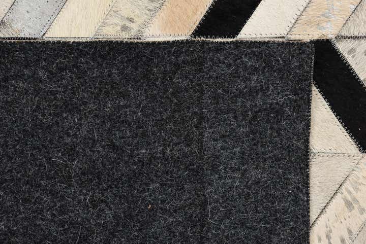 5' 3 x 8' 1 Cowhide Rug