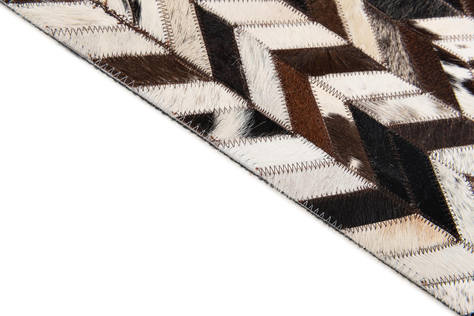 7' 7 x 9' 11 Cowhide Stocks Rug