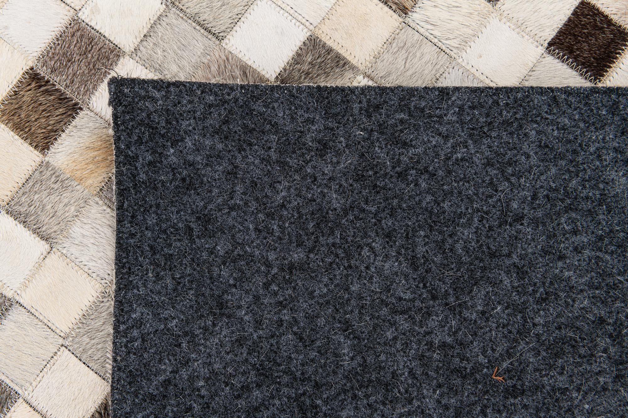 8' 1 x 9' 11 Cowhide Stocks Rug