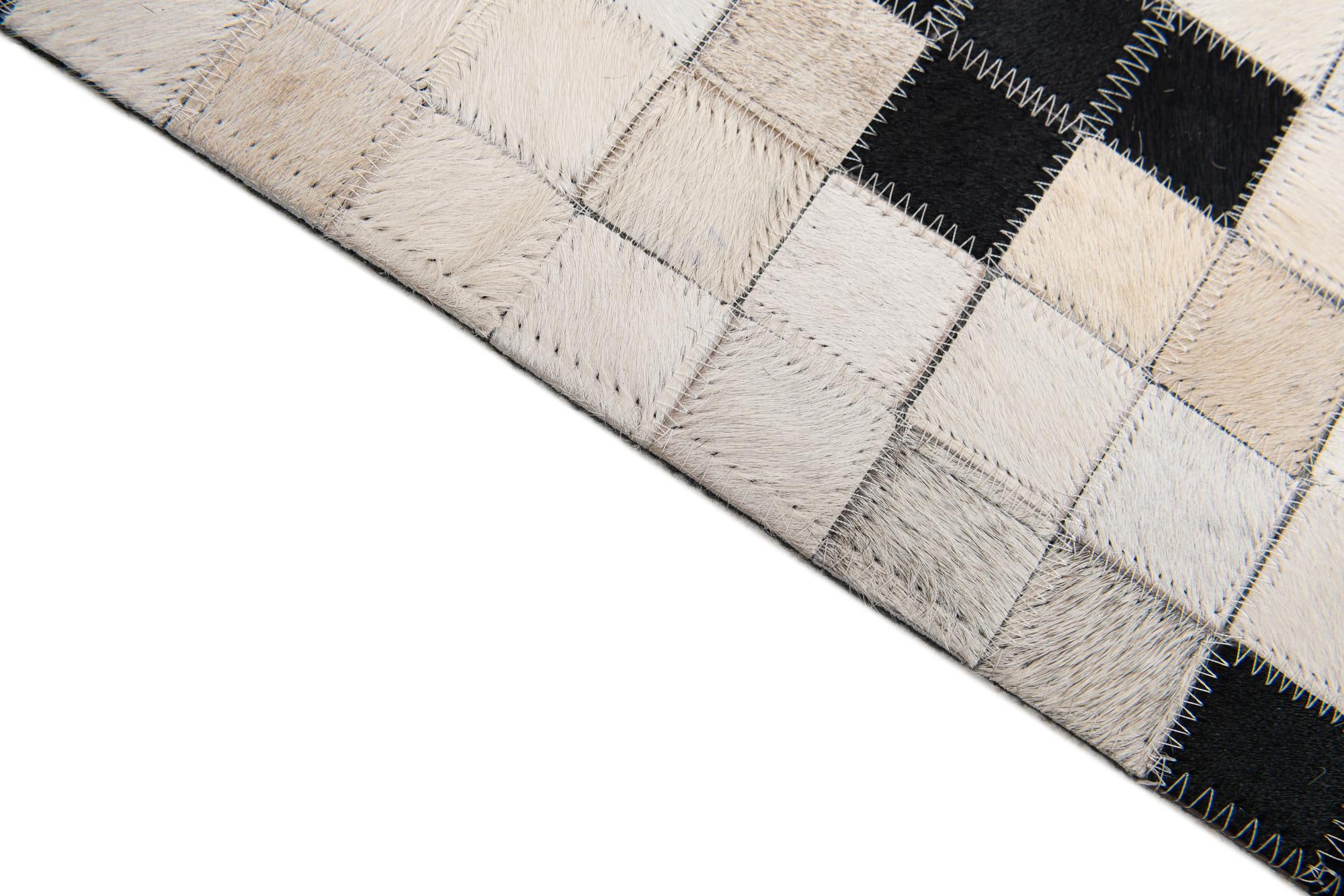 8' 1 x 9' 10 Cowhide Stocks Rug