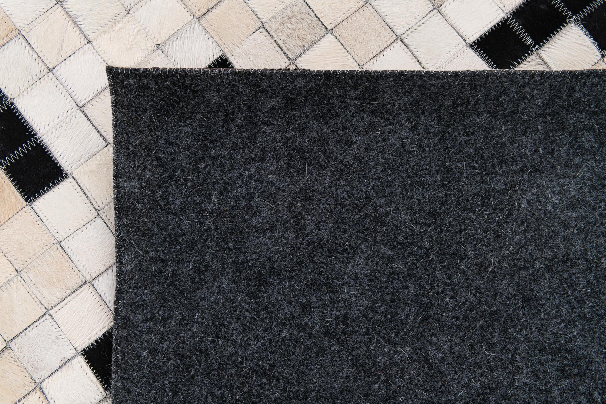 8' 1 x 9' 10 Cowhide Stocks Rug
