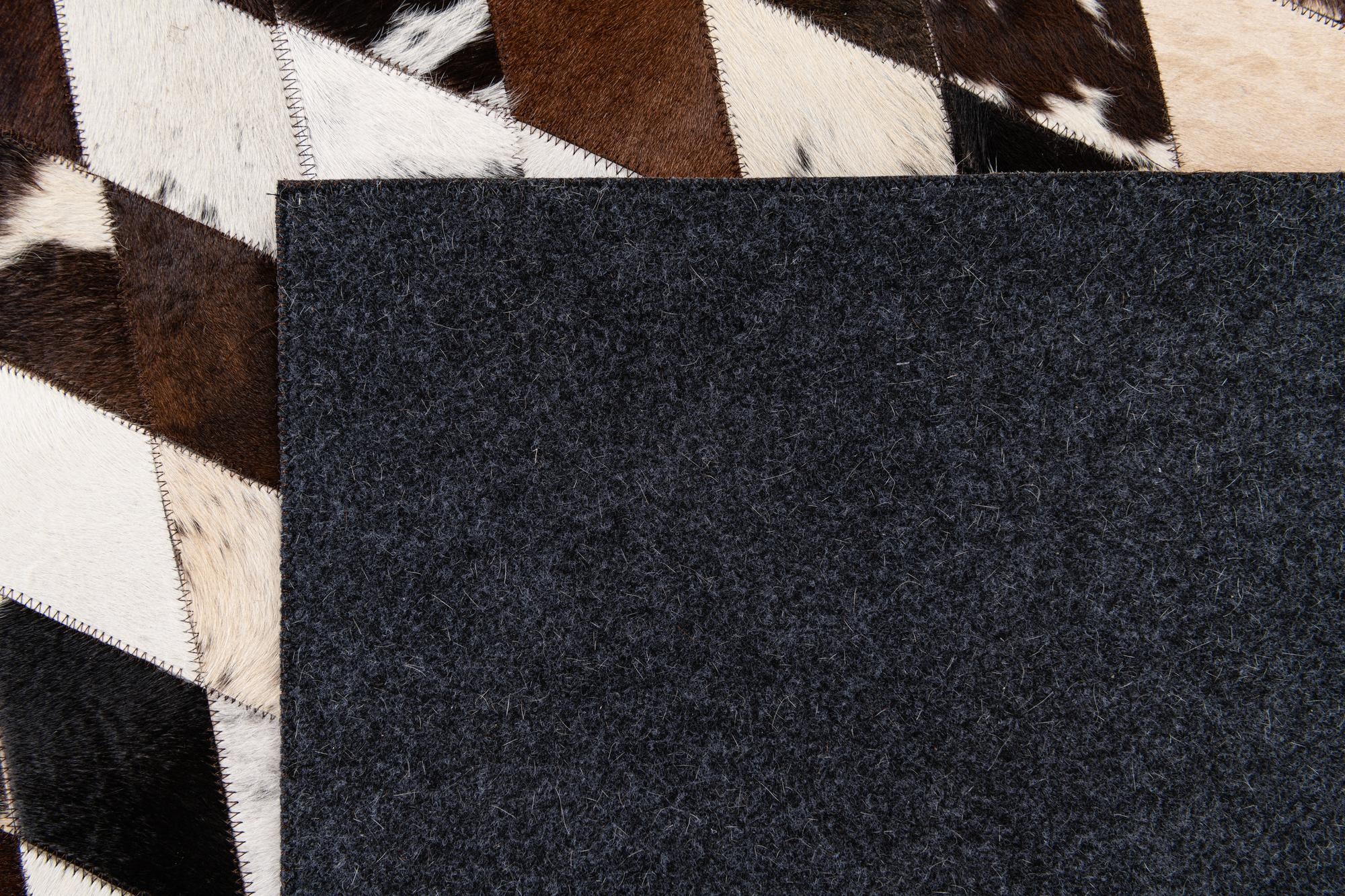 6' 7 x 9' 11 Cowhide Stocks Rug