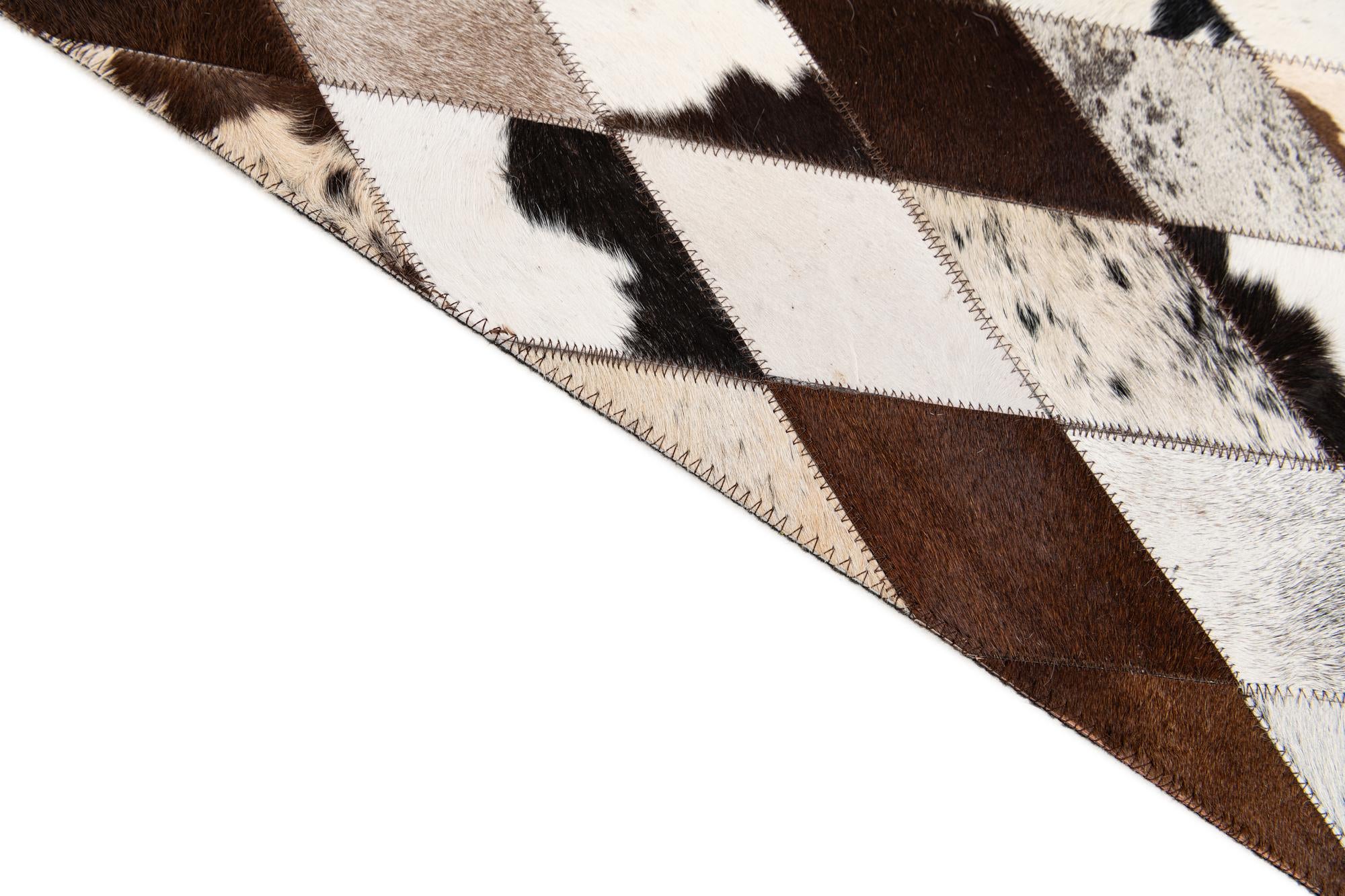 6' 7 x 9' 11 Cowhide Stocks Rug