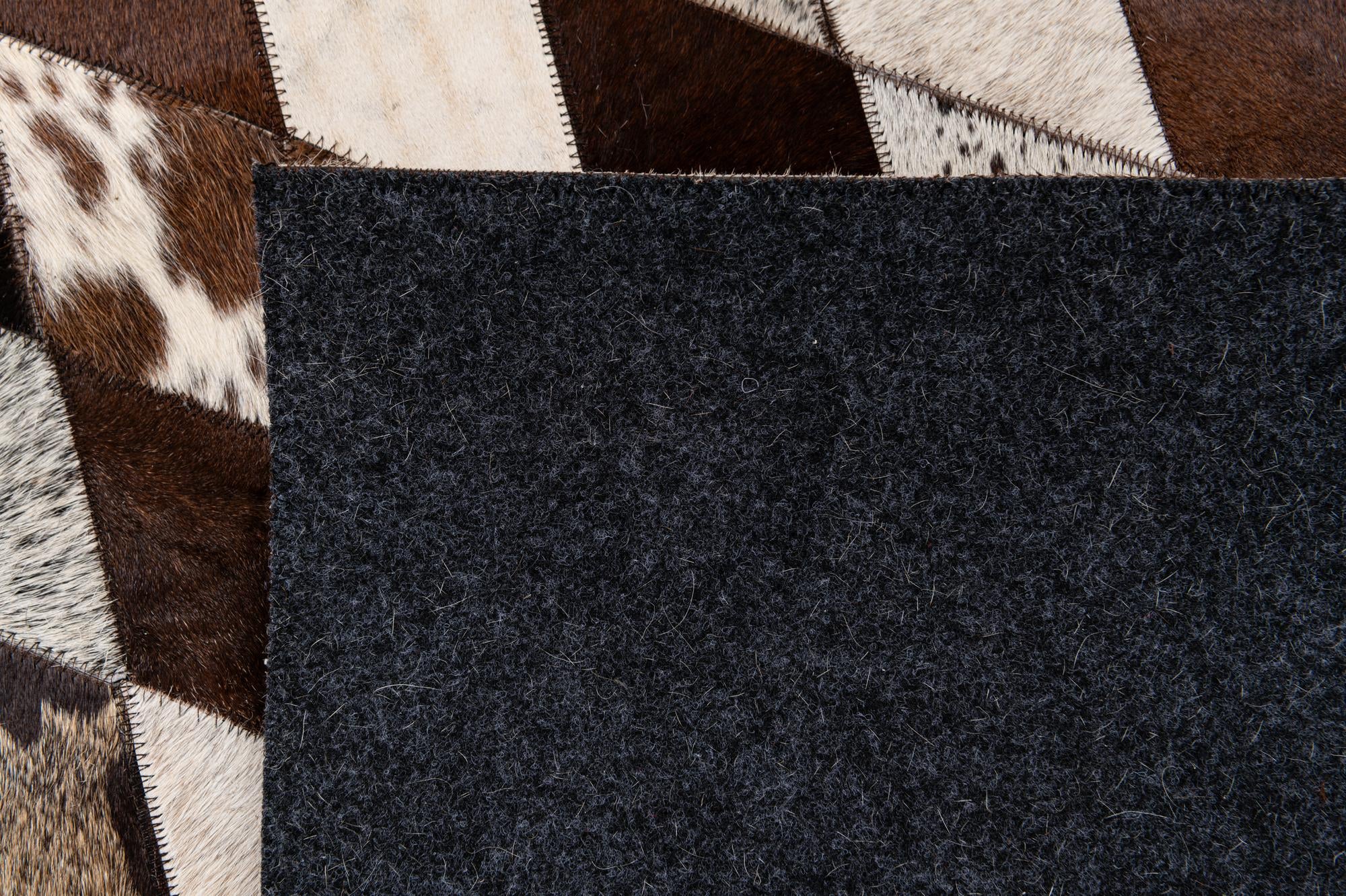 6' 7 x 9' 9 Cowhide Stocks Rug