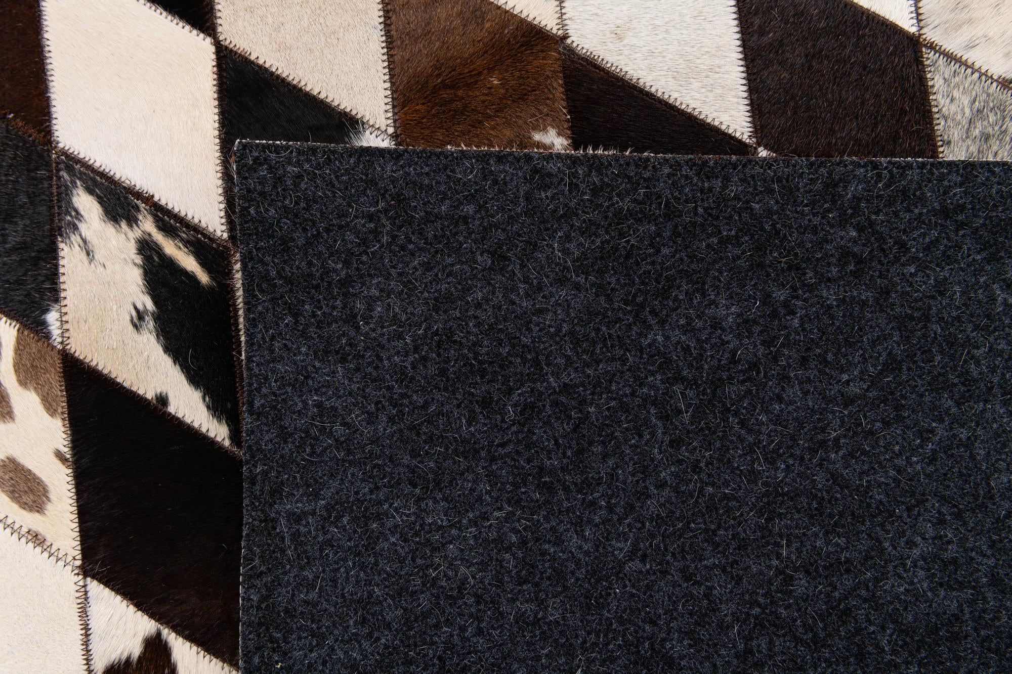 6' 7 x 9' 10 Cowhide Stocks Rug