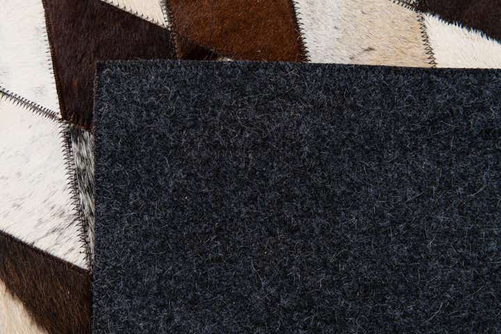 6' 7 x 9' 11 Cowhide Stocks Rug