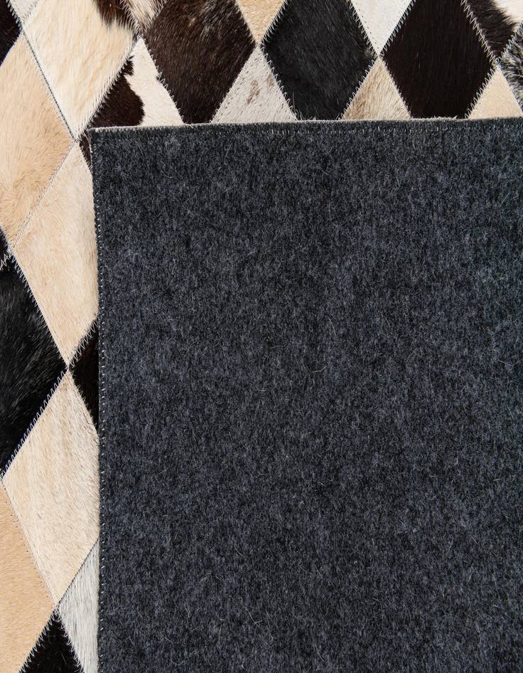 Detail image of 5' 2 x 8' Cowhide Stocks Rug