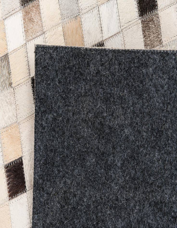 Detail image of 5' x 7' 11 Cowhide Stocks Rug