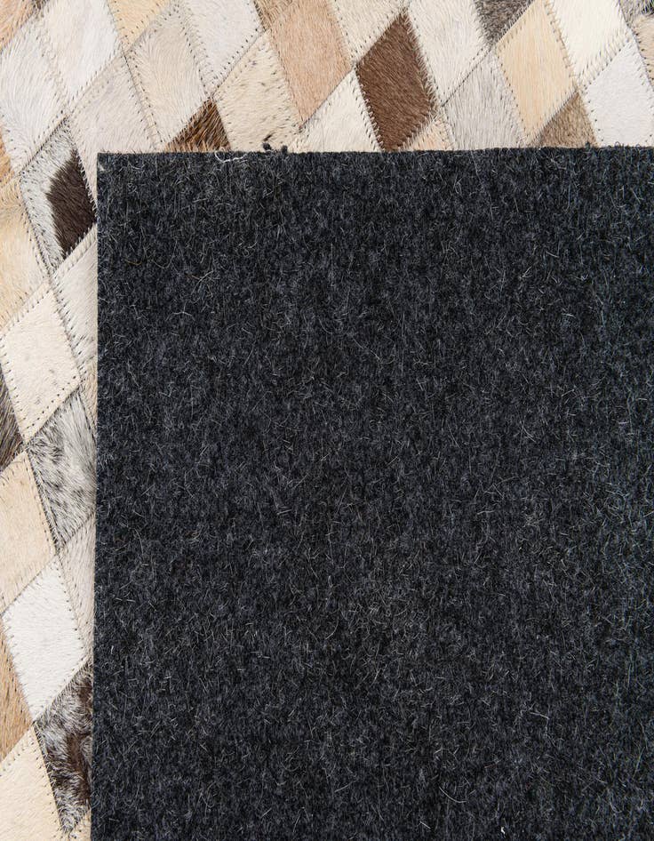 Detail image of 4' 11 x 8' Cowhide Stocks Rug