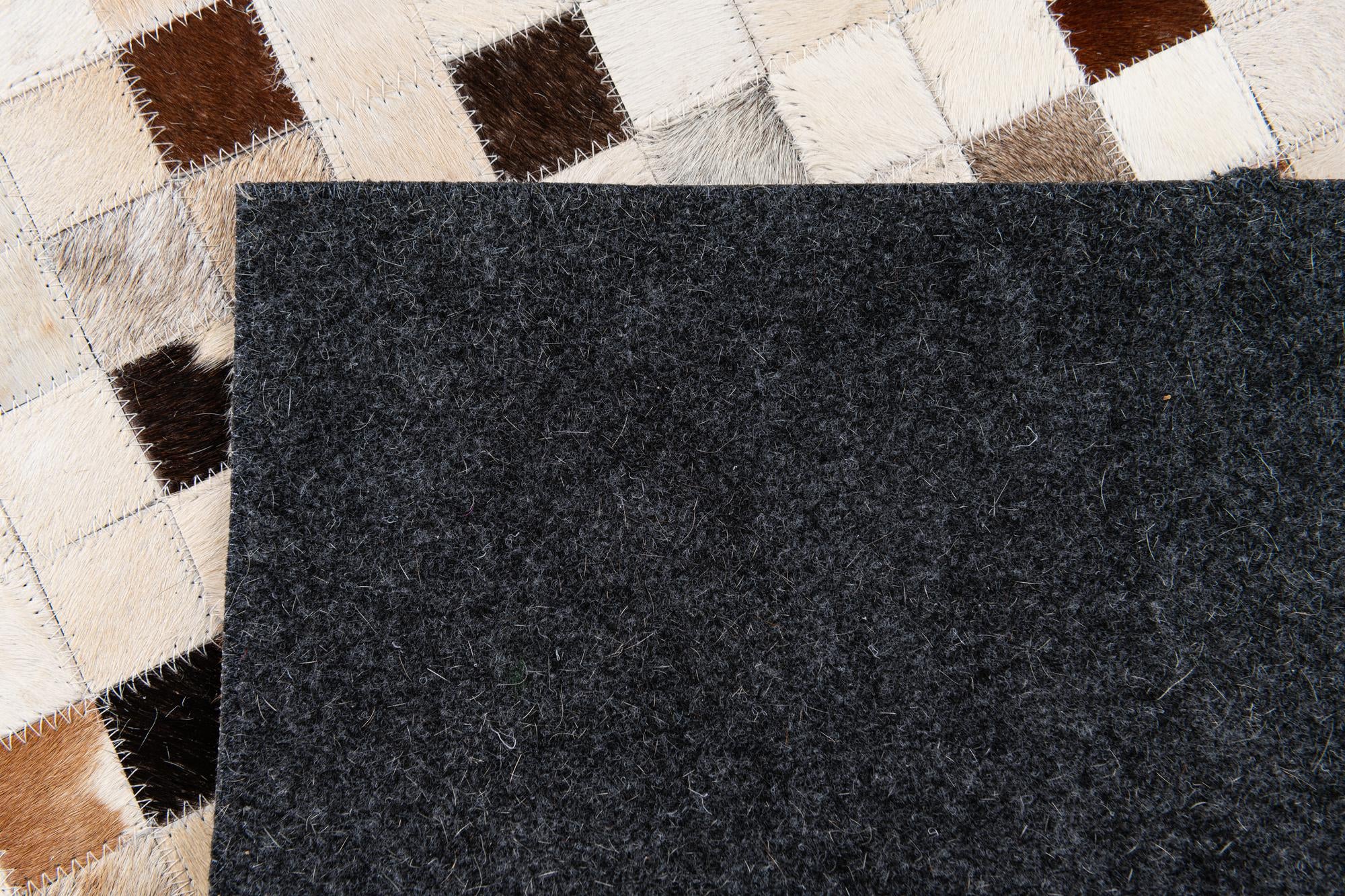 5' x 8' Cowhide Stocks Rug