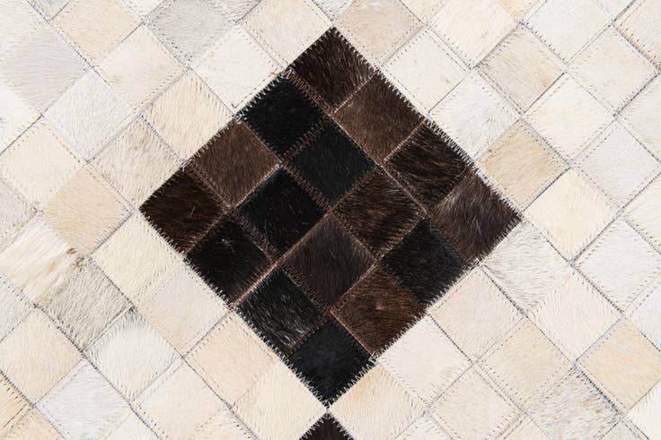 Detail image of 5' x 7' 11 Cowhide Stocks Rug