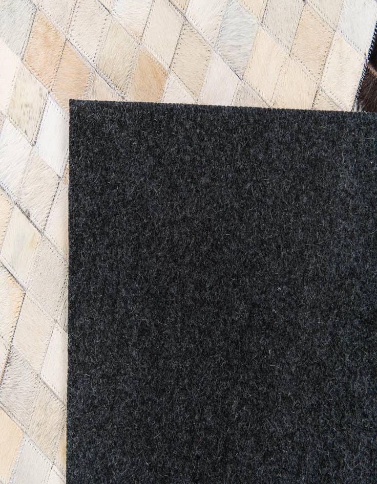 Detail image of 5' x 7' 11 Cowhide Stocks Rug