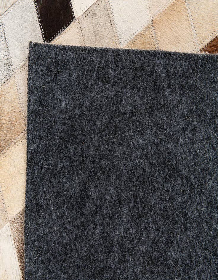 Detail image of 5' x 7' 11 Cowhide Stocks Rug