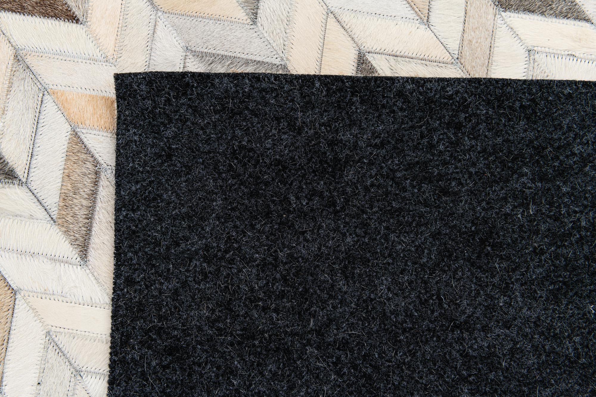 5' 8 x 8' 1 Cowhide Stocks Rug