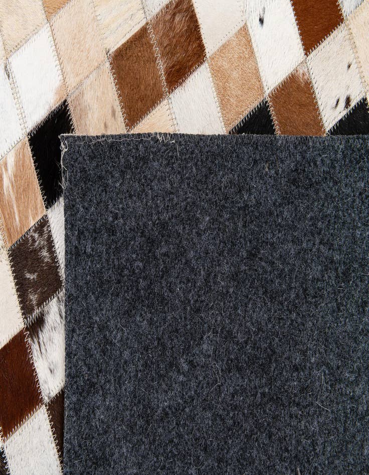 Detail image of 5' x 7' 11 Cowhide Stocks Rug