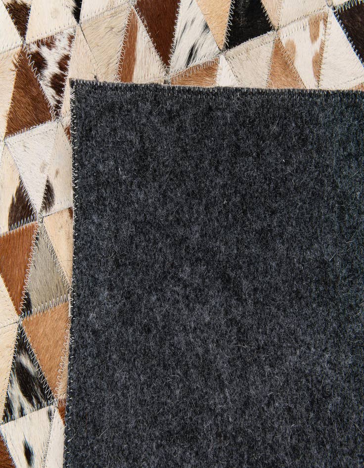 Detail image of 5' 1 x 7' 11 Cowhide Stocks Rug