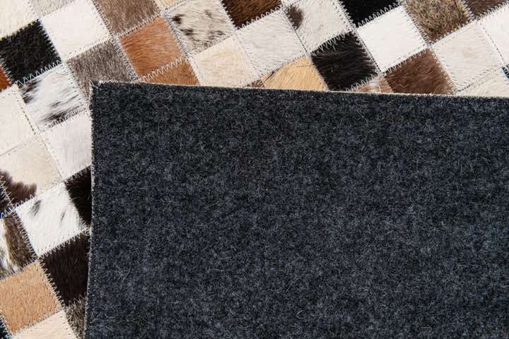 5' x 7' 9 Cowhide Stocks Rug