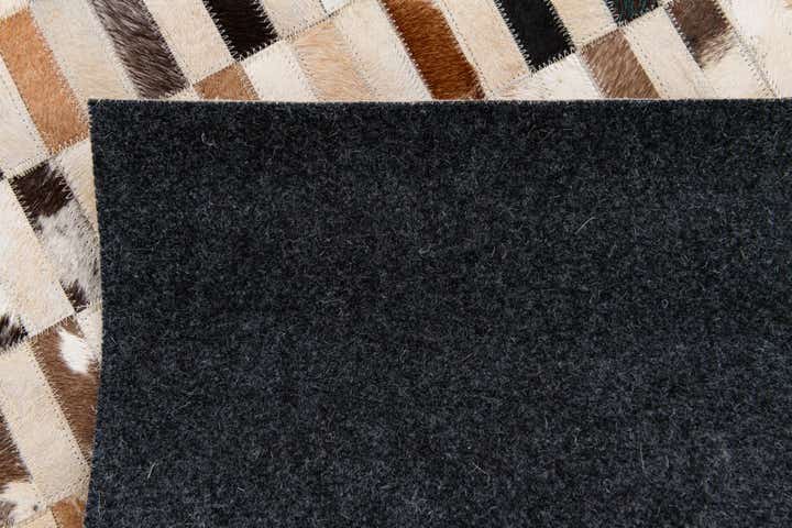 5' x 7' 9 Cowhide Stocks Rug