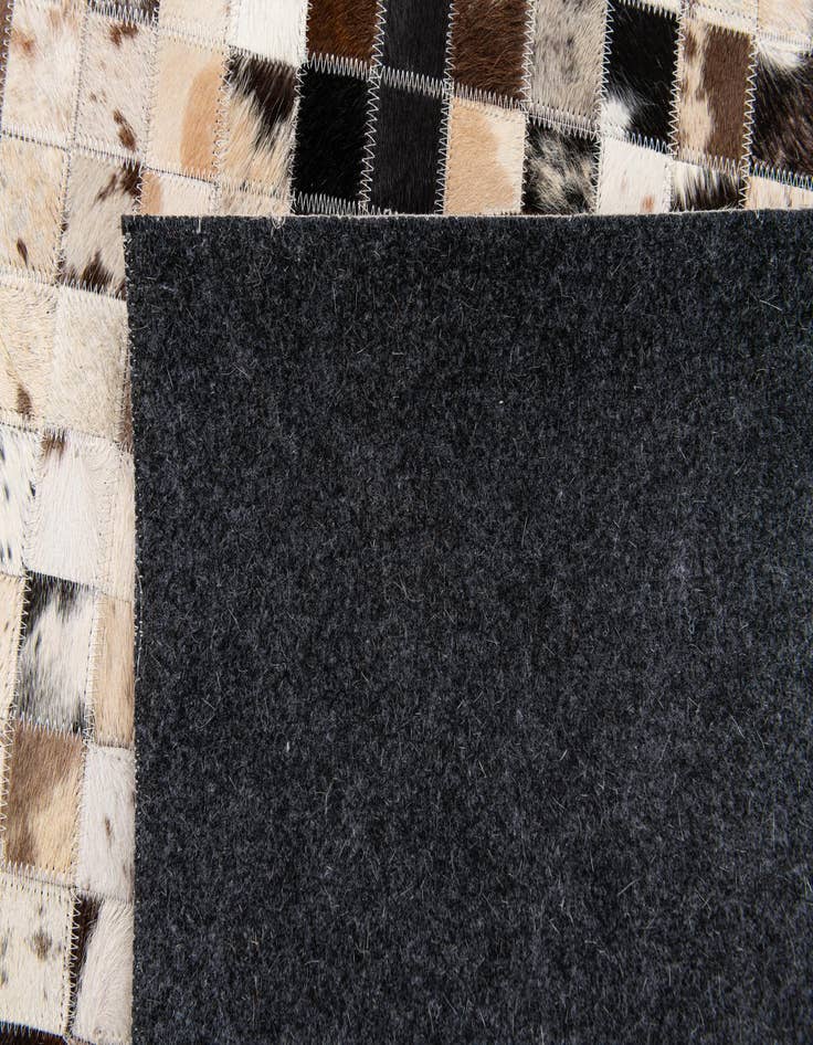 Detail image of 5' x 7' 11 Cowhide Stocks Rug