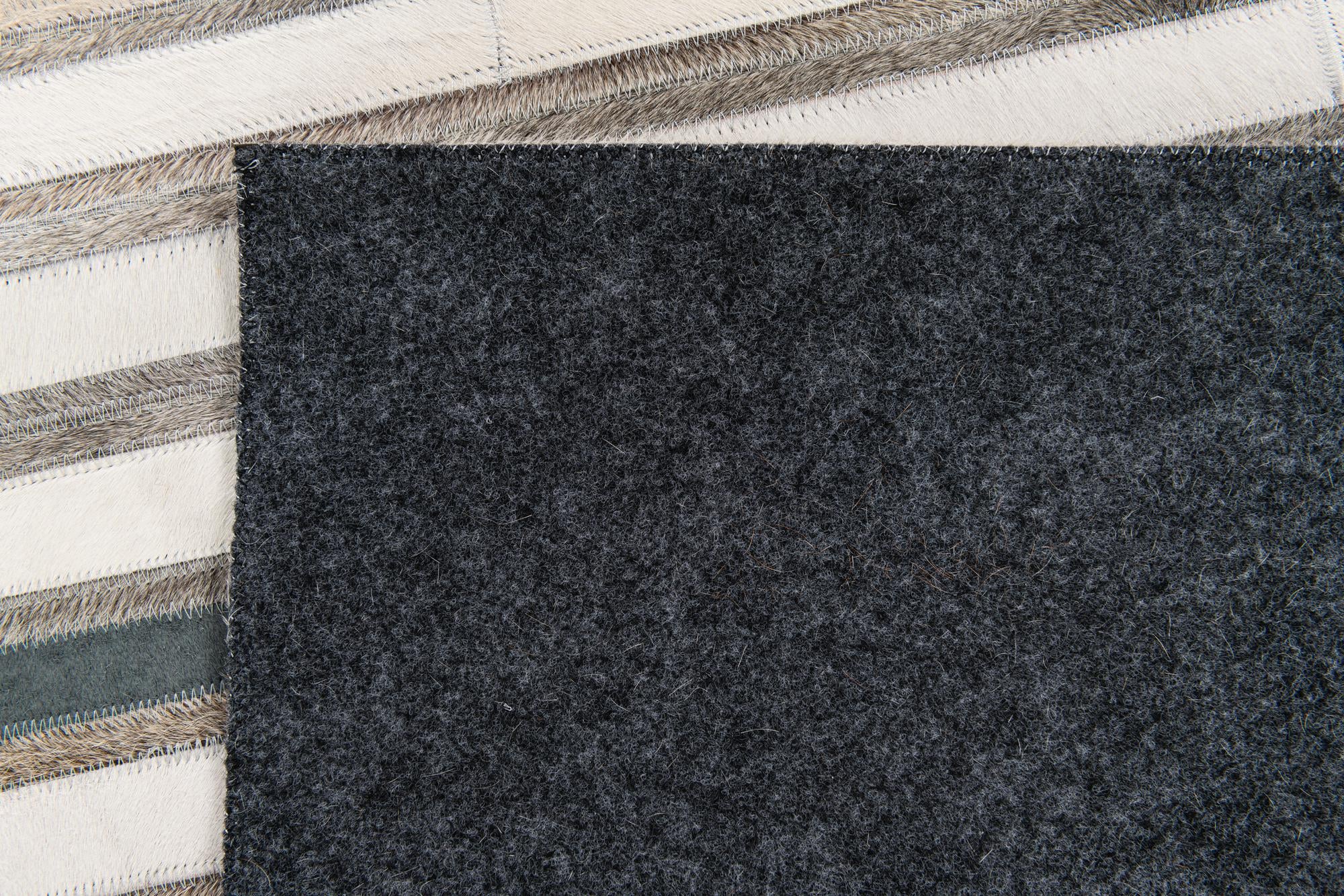 5' 1 x 7' 10 Cowhide Stocks Rug
